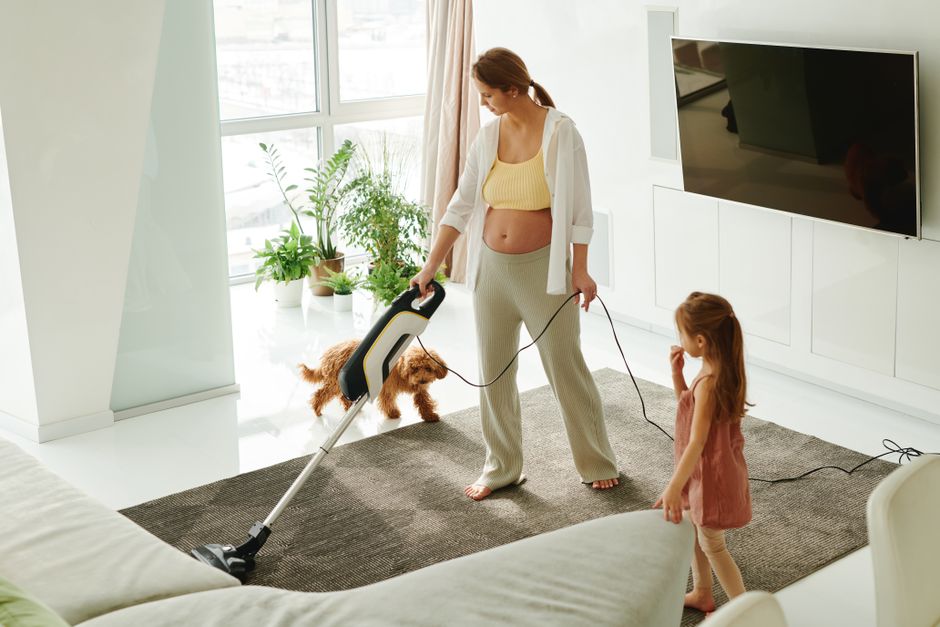 Professional vacuuming of a living room carpet